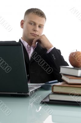 young businessman looking into laptop