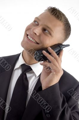young businessman smiling and talking on phone