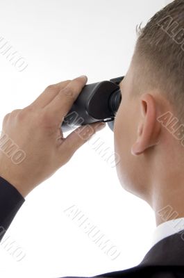 young accountant posing with binoculars