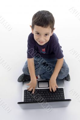 little intelligent boy doing work on laptop