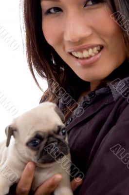 pleased woman with cute puppy