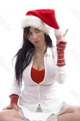 sitting sexy young female holding christmas hat