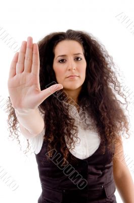 beautiful woman posing with stopping palm