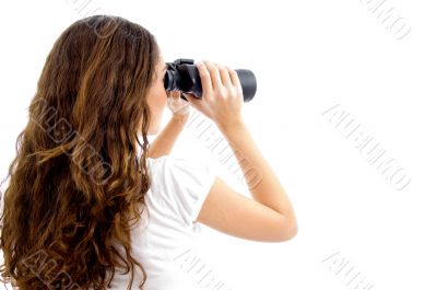 teenager girl watching through binocular