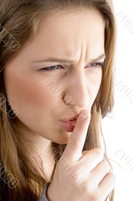 teen female face showing keep shushing sign