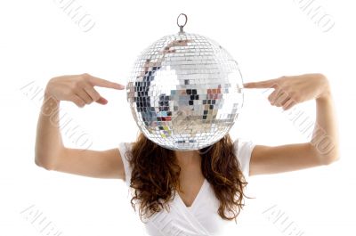 woman balancing mirror ball with fingers