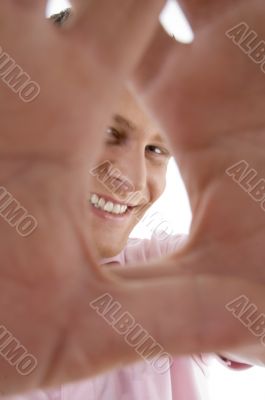 pleased man showing framing gesture