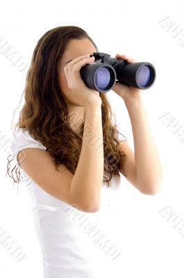 attractive model watching through binocular