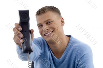 young man showing phone receiver