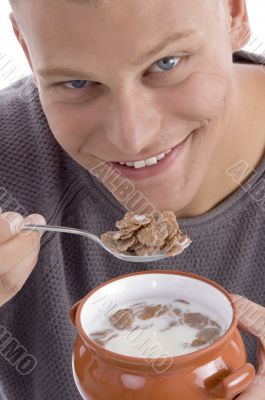 smiling handsome man going to eat cornflakes