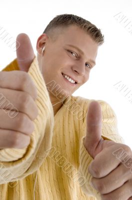 smiling guy showing good luck sign with both hands