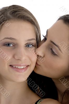 female kissing her friend