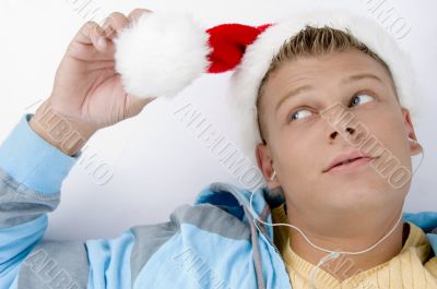blonde male looking his christmas hat