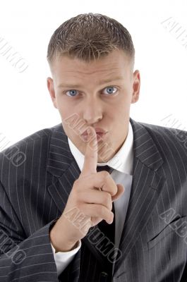 businessman asking to keep silent