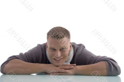 laying handsome male looking at camera laying handsome male looking at camera