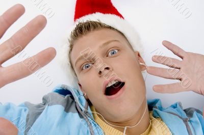 scared young man with christmas hat
