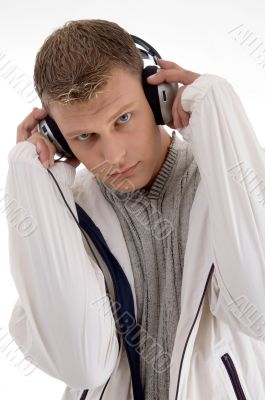 young man holding the headphone young man holding the headphone