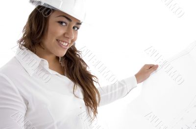 young female architect holding open blue prints