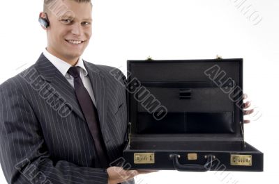 smiling businessman showing his empty office