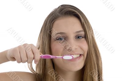 charming woman brushing her teeth charming woman brushing her teeth