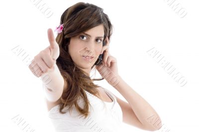 woman with cell phone showing approval sign