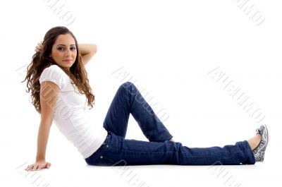 beautiful young model sitting on ground