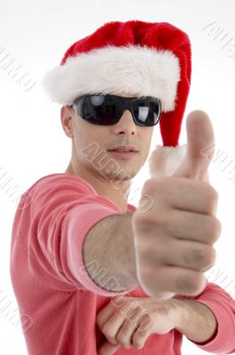 handsome man with christmas hat wishing good luck