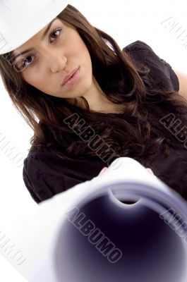 female architect with helmet and showing blueprint