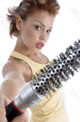 woman posing with roller comb
