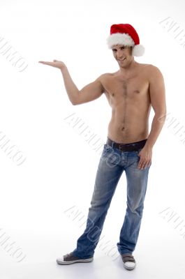 shirtless male model posing with christmas hat