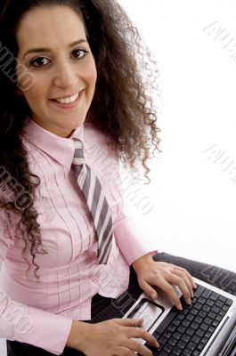 beautiful young businesswoman working on laptop