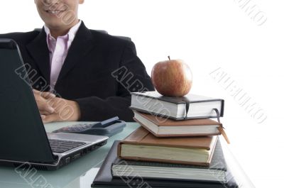 businessman with apple and books