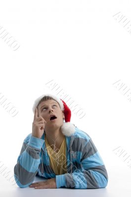 man pointing upward and wearing christmas hat man pointing upward and wearing christmas hat