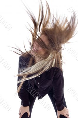 beautiful brunette playing with her stylish hair