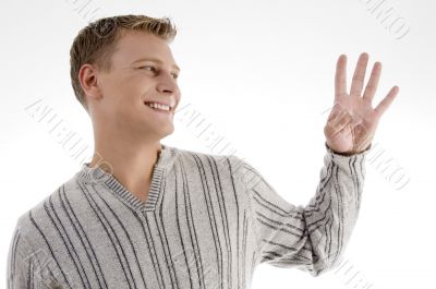 smiling man with counting hand gesture smiling man with counting hand gesture