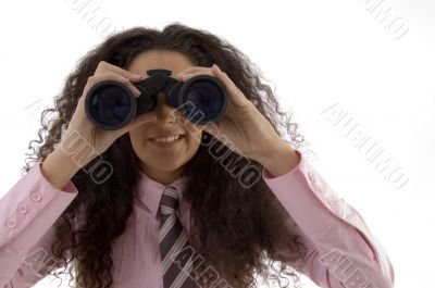 young corporate woman viewing through binoculars