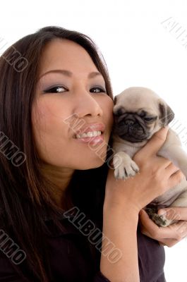 smiling woman holding puppy