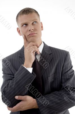 thinking businessman looking upward