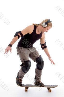 young male model balancing skateboard