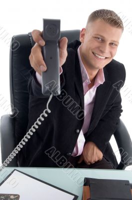 happy businessman showing receiver