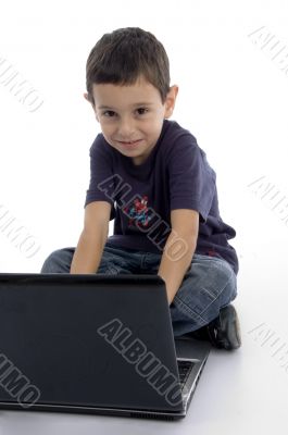 little intelligent boy doing work on laptop