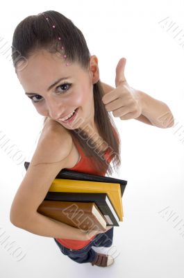 high angle view of student showing good luck sign