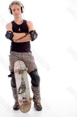 handsome guy posing with skateboard
