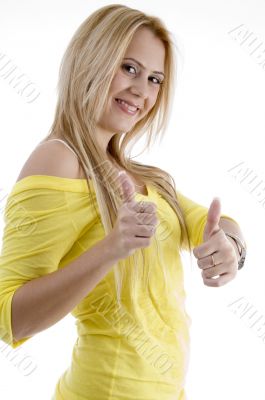 smiling woman showing good luck sign