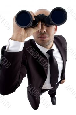handsome young lawyer looking through binoculars