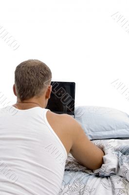 back pose of laying man with laptop back pose of laying man with laptop