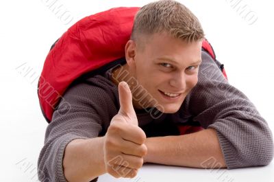 young guy showing thumbs up