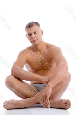 sitting muscular man