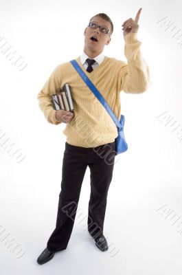 young student carrying bag and books