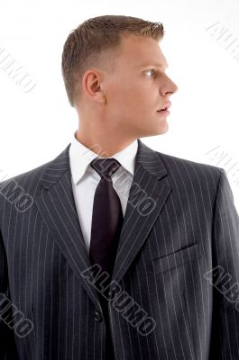young businessman looking sideways